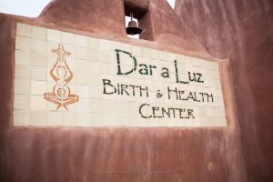 dar a luz birth and health center sign with a tile design
